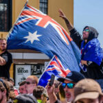 Crowd with Australian flags at an outdoor rally