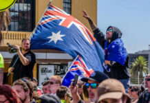 China FEARS Ignite: Australia’s Bold Defense Overhaul Crowd with Australian flags at an outdoor rally