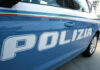 Close-up of a blue police car with the word 'POLIZIA' displayed