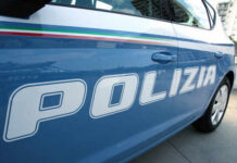 Close-up of a blue police car with the word 'POLIZIA' displayed