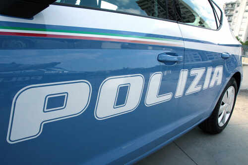 Close-up of a blue police car with the word 'POLIZIA' displayed