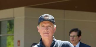 Politician speaking at a press conference outdoors