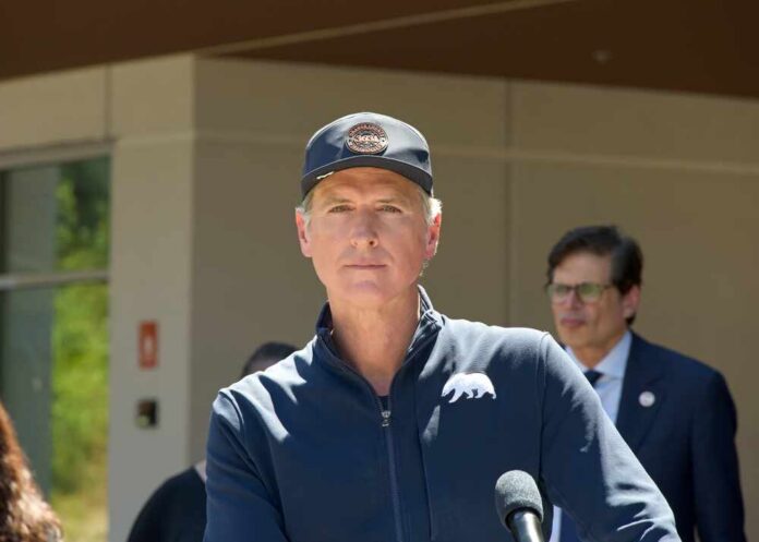 Politician speaking at a press conference outdoors