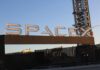 Sign displaying the SpaceX logo at a launch site
