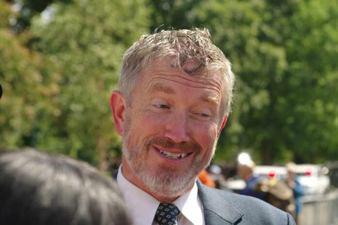 Washington,,Dc,-,September,3,,2025:,U.s.,Rep.,Thomas,Massie A smiling man in a suit engaging in conversation outdoors