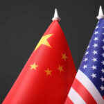 Xi’s Iran Promise – Real Deal or Summit Theater? Chinese and American flags side by side.