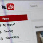 Close-up of YouTube homepage navigation menu.