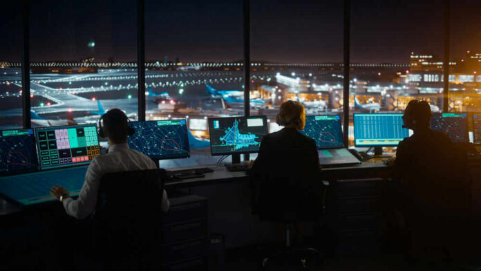 air-traffic-controller700293964 Air traffic controllers working at night airport tower