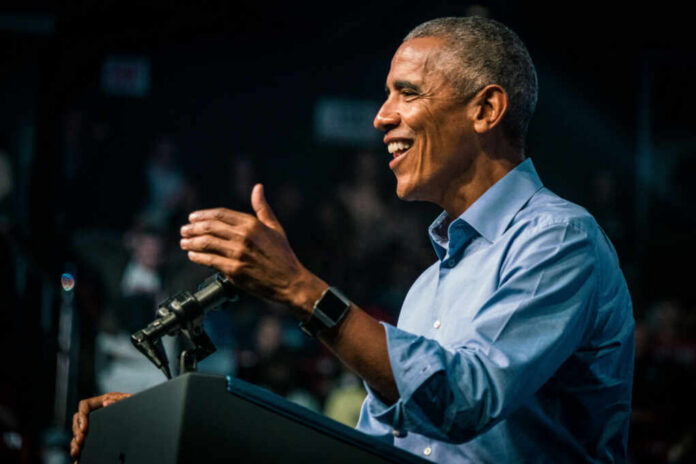 barack-obama-smiles-and-gives-speech2230438611jpg Smiling man speaking at a podium