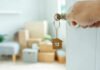 Hand turning door key with house-shaped keychain