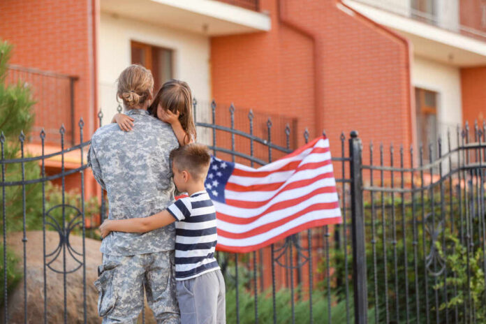 Sad,Little,Children,Saying,Goodbye,To,Their,Military,Father,Outdoors Group of students walking together on campus