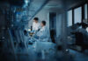 Obama Biolabs Bombshell — Or Just Bureaucracy? Two scientists working in a laboratory with a microscope and computer screens