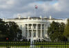 The White House with an American flag flying above it