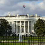 Susie Wiles Exit Rumors Denied — White House Slams “Hit Piece” The White House with an American flag flying above it