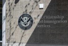 Feds Find Fake Jobs, Sham Marriages Signage for U.S. Citizenship and Immigration Services on a building