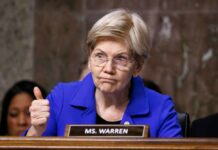 A senator giving a thumbs up during a hearing
