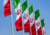Propaganda Alert: ‘Water Strike’ Mystery Multiple Iranian flags waving against a clear blue sky