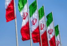 Propaganda Alert: ‘Water Strike’ Mystery Multiple Iranian flags waving against a clear blue sky