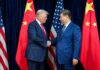 U.S.–China Rivalry Escalates Into Global Power Struggle Two political leaders shaking hands in front of national flags