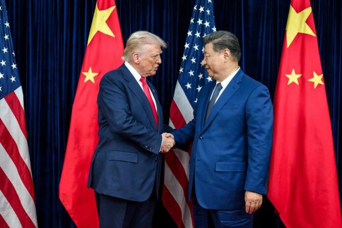 Busan,,South,Korea,,October,30,,2025:,Chinese,President,Xi Two political leaders shaking hands in front of national flags