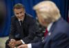 Ukraine Stakes Rattle Macron–Trump Huddle Two political leaders engaged in a conversation, one smiling