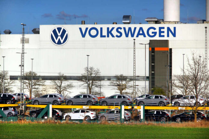 volkswagen-headquarters2441885999jpg Volkswagen factory exterior with new cars on transport racks