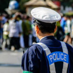 Police officer monitoring a crowd at an outdoor event