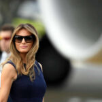 Media Retreats After Melania Strikes I dont know who this is sunglasses blue dress