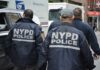 NYPD officers walking on a city street
