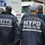 NYPD officers walking on a city street