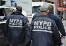 Taylor’s Overtime Tab—Not The Full Bill? NYPD officers walking on a city street