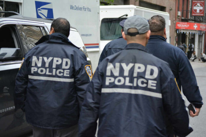 NYPD officers walking on a city street