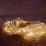 Ancient Egyptian golden sarcophagus lid with carved details