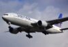 Commercial airliner approaching landing with landing gear down