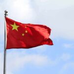 Chinese national flag waving on a flagpole