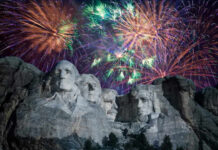 Fireworks exploding over Mount Rushmore at night
