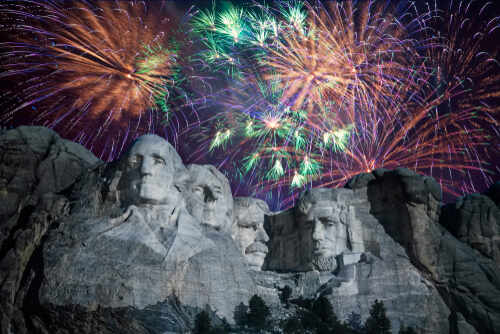 Mount,Rushmore,National,Memorial,In,South,Dakota,(usa),With,Fireworks Fireworks exploding over Mount Rushmore at night