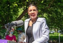 Wrong Messenger? Dems Panic Quietly Woman speaking at an outdoor podium with a microphone
