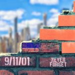 Brick wall with American flag and memorial text against city skyline