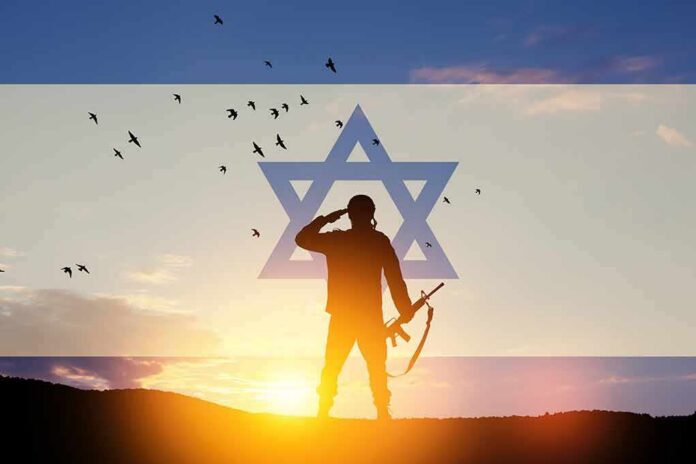 shutterstock_2152101211 silhouetted soldier saluting at sunset with star symbol overlay
