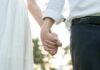 Couple holding hands outdoors