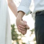 Couple holding hands outdoors