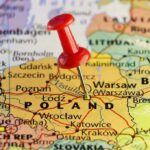 Spending Shock: Poland Blazes Past 3.5% Red pushpin marking Poland on a European map