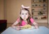 Free Pasta Sparks Voter ID Brawl Girl eating spaghetti at a table