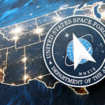 United States Space Force emblem over a lit map of the United States