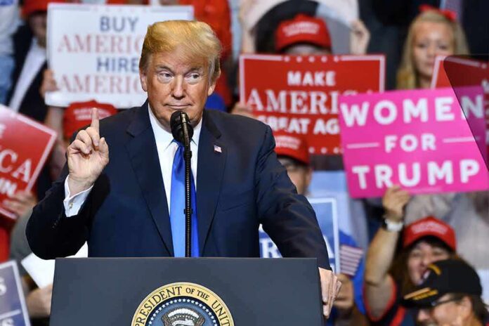 politician speaking at rally podium