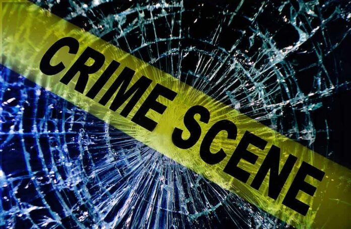 shutterstock_124715593 Crime scene tape over shattered glass