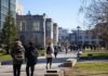 students walking on a university campus pathway