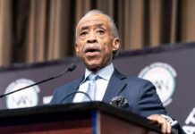 Sharpton Slams ‘Rigged’ Maps — Courts Next? Elderly man in suit speaking at a podium