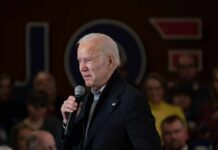 Shifting Storylines Rattle Democrat Core older man speaking into a microphone at an indoor event